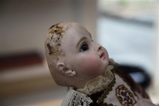 A Jumeau bisque head doll, stamped 7EJ, late 19th century, height 17.5in., small firing crack to right ear